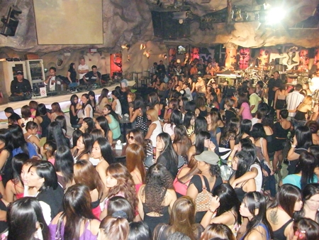 Police keep exits to a crowded bar blocked off as they test everyone there for illicit drug use.